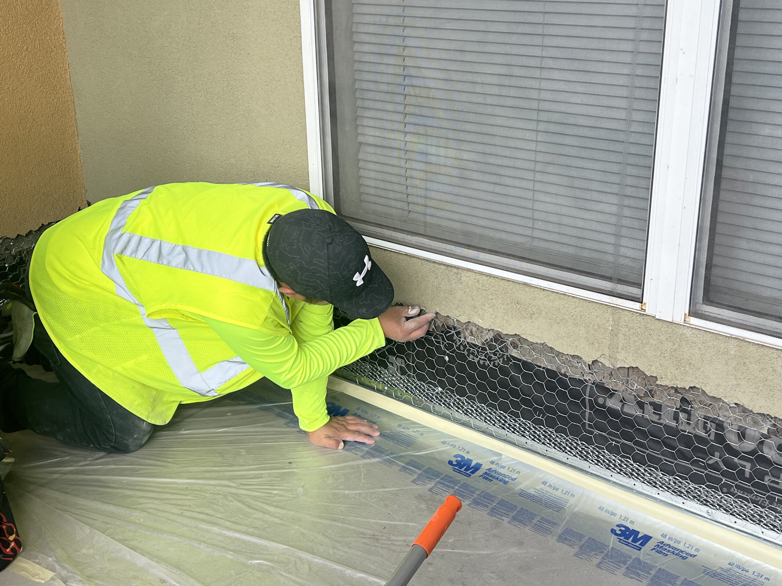 stucco repair and lath preparation on multifamily exterior wall