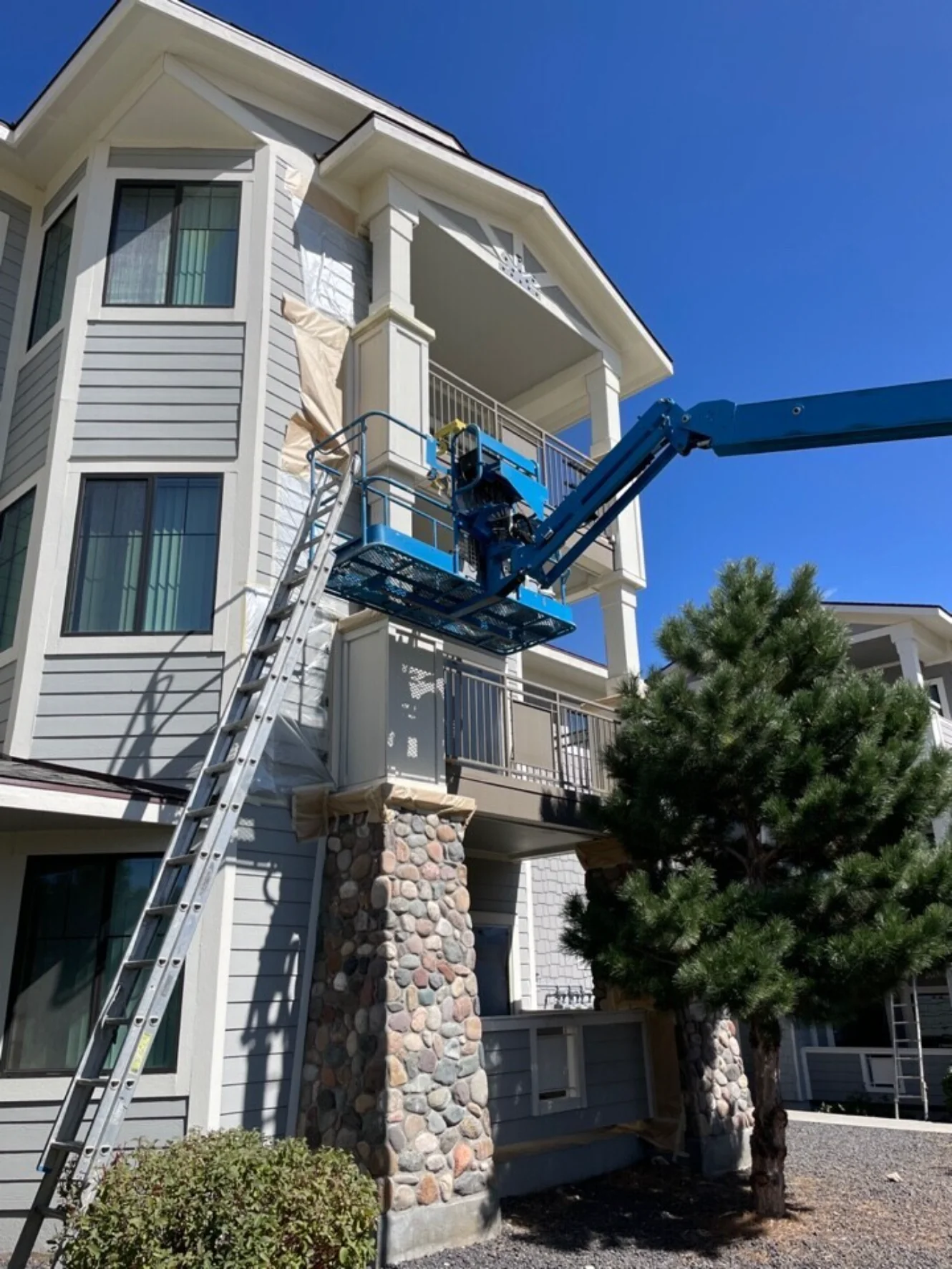 Exterior painting and metal repair at multifamily building